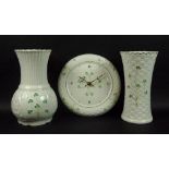 A collection of Belleek ceramics comprising a Shamrock Colleen vase, 25cm, Shamrock wall clock,