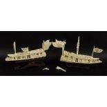 A near pair of Chinese ivory junks, early 20th century, intricately carved, one with eight flags,