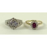 A 15ct gold, ruby and diamond ring, the central oval cut ruby surrounded by fourteen diamonds,