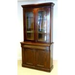 A late Victorian mahogany glazed bookcase, 107 by 42 by 210cm high.