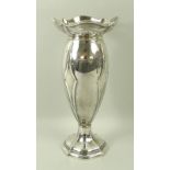 A silver Art Nouveau vase with pierced rim,