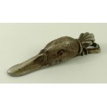 A silver metal desktop paper clip modelled as the head of a duck, early 20th century,