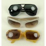 A collection of designer sunglasses comprising a pair of Gianfranco Ferre, Fendi,