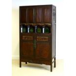 An early 20th century Chinese carved hardwood cabinet,