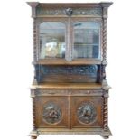 A 19th century oak bookcase, in the 17th century Dutch style,