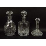 A group of three decanters, comprising a Tudor Crystal cut glass decanter,