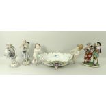 A Volkstedt ceramic figural group, 19th century, of a couple with sticks and flowers,