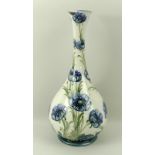 A Moorcroft Macintyre Florian ware porcelain bottle vase, circa 1903, in the 'Blue Poppy' pattern,