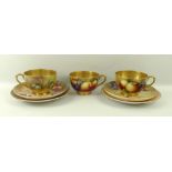 A Royal Worcester trio, comprising tea cup, saucer and plate, signed H Aynton and Moseley,