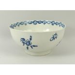 A first period Worcester bowl, circa 1770, with under glaze cobalt blue sprigs,