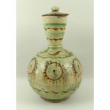 A tin glazed earthenware bottle jar and cover, early 18th century,