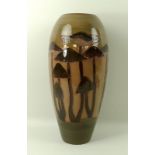 A Moorcroft vase, the brown ground decorated with tubelined mushrooms, in the 101/14 shape,