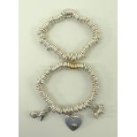 A Links of London sterling silver Sweetie bracelet, and another with three charms attached,