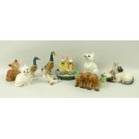 A group of Beswick animal figurines comprising a family of three ducks of graduated size,