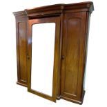 A Victorian mahogany compactum wardrobe, ogee cornice,