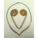 A 9ct gold rope twist necklace, 60cm long, and a 9ct rose,