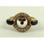 An Art Deco style 14ct gold ring set with sapphires, emerald ruby and paste stones, 4g, size R/S.