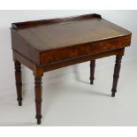 A William IV and later mahogany desk, with sloped lift lid, strung with ebony,