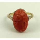 A 19th century 9ct gold and coral cameo ring, size L/M.