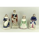 A pair of Staffordshire figures of Queen Victoria, seated with baby Princess Royal,
