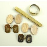 A pair of 9ct gold oval cuff links, a further pair of 9ct gold cuff links with S monogram,