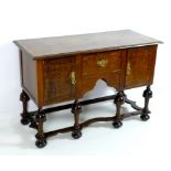 A Jacobean style server sideboard, mid 20th century, with quarter veneered surface,