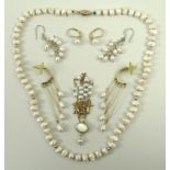 A single strand of freshwater pearls, in bell and acorn shapes, with 14ct gold clasp, 40cm,