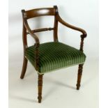 A Regency mahogany open armchair, bar back, spiral carved rail, turned front legs,