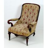 A Victorian mahogany spoon back easy armchair, shaped crook open arms,