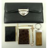 A Louis Vuitton black Epi leather wallet, with grained calf lining, silvered brass lock closure,