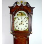 A George III oak cased long case clock, white dial with painted scenes to the corner,