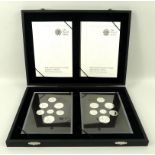 A case holding two Elizabeth II silver proof coin sets, comprising fourteen silver proof coins,