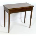 A Regency mahogany and inlaid card table, fold out surface with green baize,