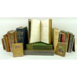 A collection of vintage books, including a Victorian volume of hand written poems dated 1824.