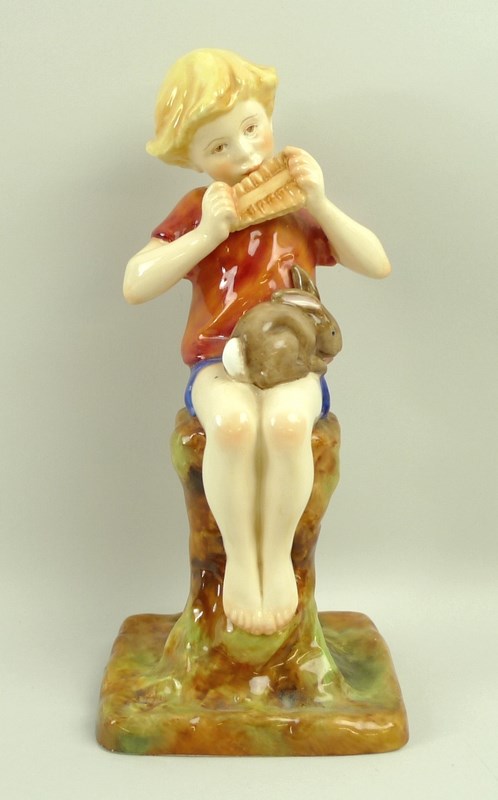 A Royal Worcester figurine of Peter Pan, number 3011, with a red shirt, modelled by F.