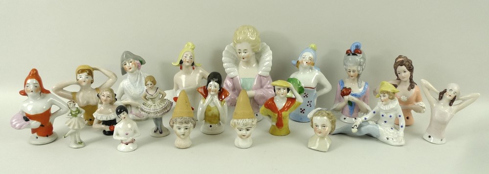 A collection of pin cushion dolls, 19th and early 20th century, comprising half dolls and heads.