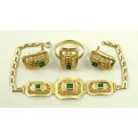An emerald and gold parure comprising a bracelet with three baguette cut emeralds set within three
