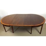 A George III D-end dining table with two extra leaves, the mahogany top cross-banded with yew,