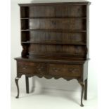 A Georgian style oak dresser, late 19th / early 20th century, plate rack with three shelves,