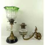 A Victorian oil lamp with clear faceted glass reservoir,