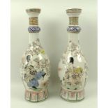 A pair of Japanese vases, late 19th century, of ovoid form, with long necks,