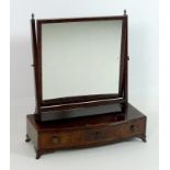 A Regency mahogany toilet mirror, with bowed crossbanded base, oak lined drawers,