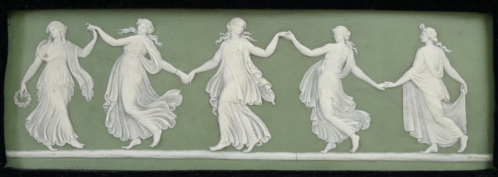 A Wedgwood rectangular plaque depicting dancing girls on an olive green ground, 8 by 23cm. - Image 2 of 3