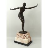 A French Art Deco style bronze of a dancing woman, dressed in the Egyptian style,