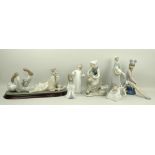 A collection of Lladro figurines, comprising a young woman with a goose and a dog, 27cm,