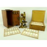A brass microscope, R&J Beck, London 22629, in a mahogany case with three eye pieces/lenses,
