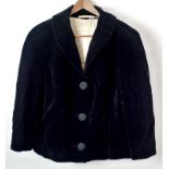 A lady's 1940's fitted black jacket, with slanted and braided pockets,