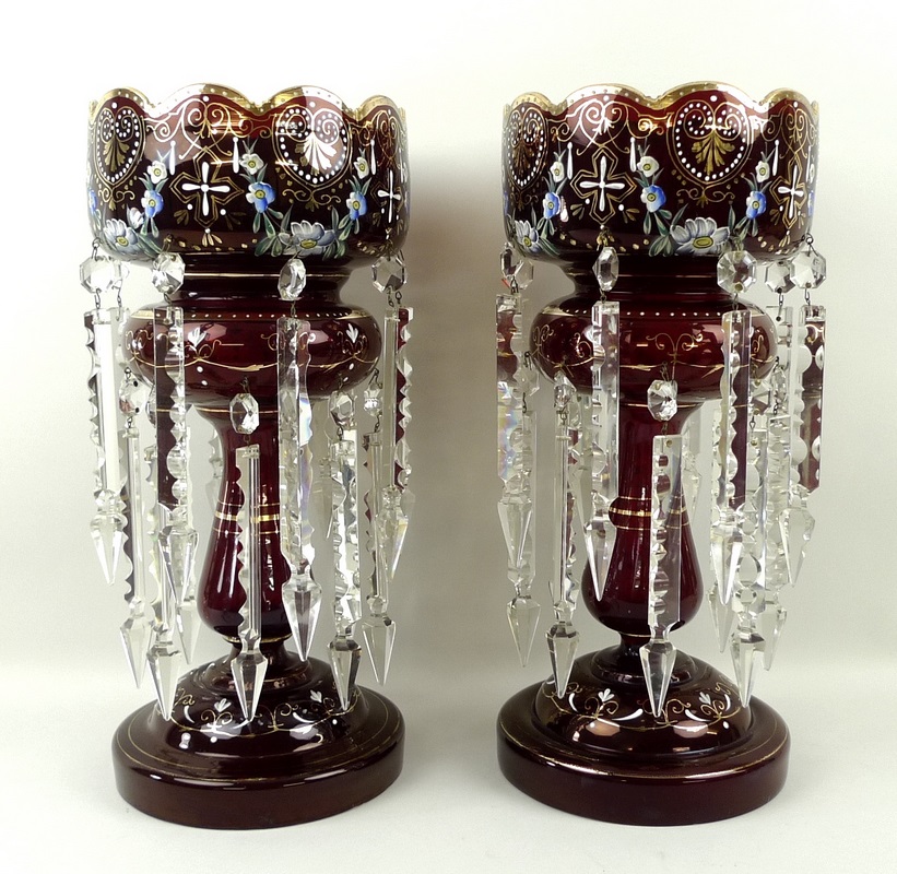 A pair of Bohemian ruby glass lustres, enamelled with floral sprays and hand gilded, circa 1890,