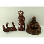 A group of three Chinese hardwood carvings, early 20th century, comprising a seated Buddha, 14cm,