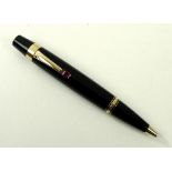 A Montblanc Boheme Rouge 25200 ballpoint pen, black resin with gold coloured fittings,